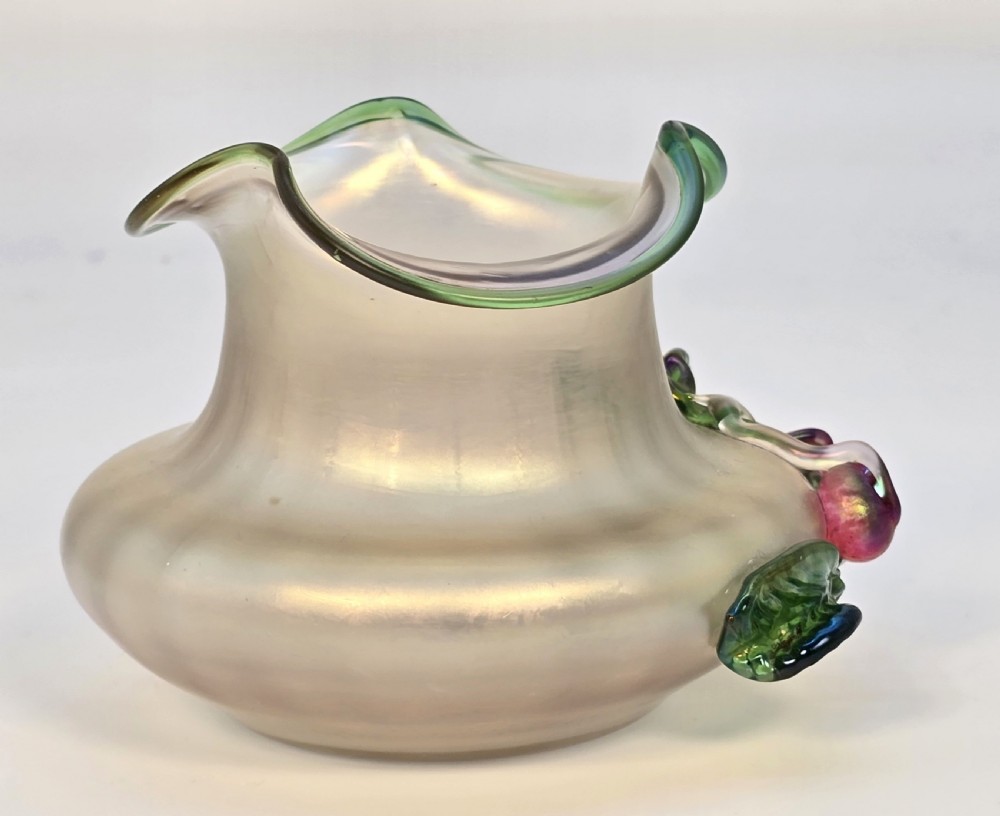 An Art Nouveau iridescent glass vase featuring a wavy green-rimmed mouth and hand-applied glass cherries with green leaves on the side. View VIII