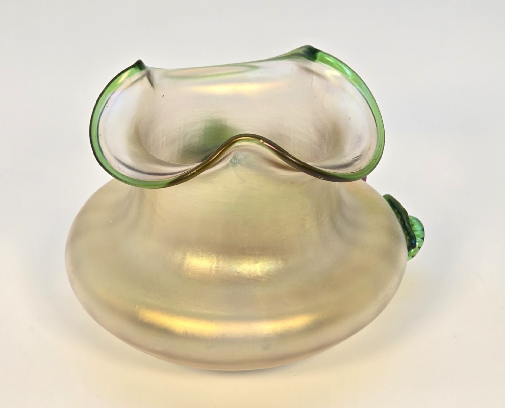 An Art Nouveau iridescent glass vase featuring a wavy green-rimmed mouth and hand-applied glass cherries with green leaves on the side. View XIII
