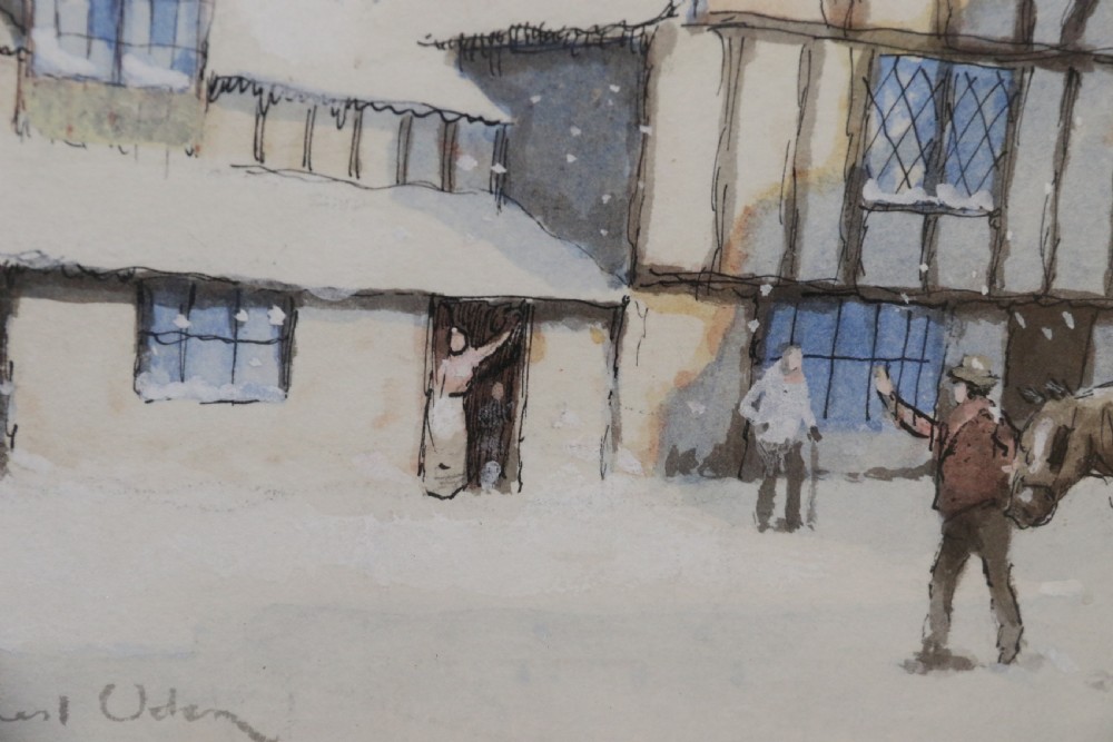 A pair of framed 1930s watercolour paintings by Ernest Uden depicting snowy rural winter scenes featuring a windmill and a timber-framed building. View V