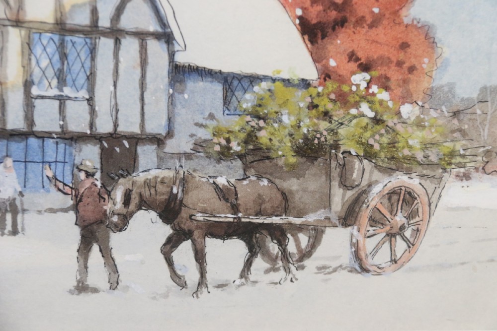 A pair of framed 1930s watercolour paintings by Ernest Uden depicting snowy rural winter scenes featuring a windmill and a timber-framed building. View VIII