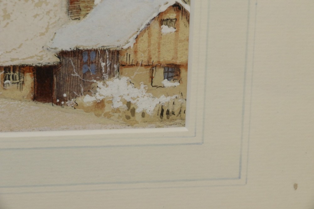 A pair of framed 1930s watercolour paintings by Ernest Uden depicting snowy rural winter scenes featuring a windmill and a timber-framed building. View XII