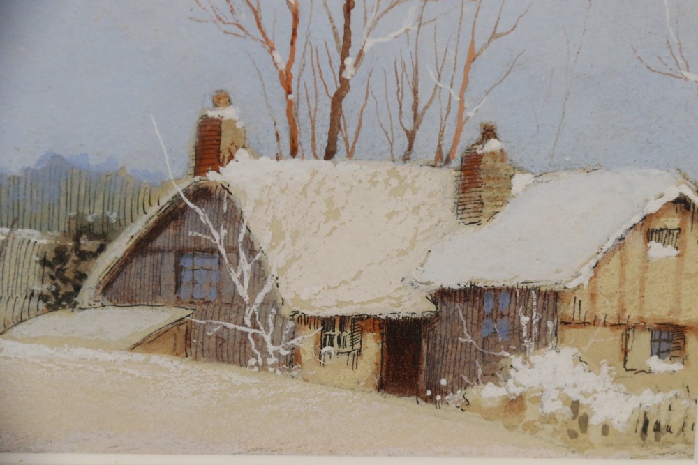 A pair of framed 1930s watercolour paintings by Ernest Uden depicting snowy rural winter scenes featuring a windmill and a timber-framed building. View XIV
