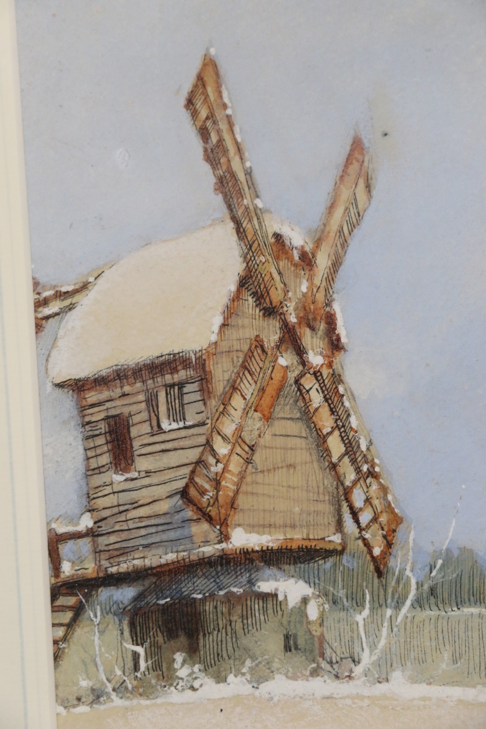 A pair of framed 1930s watercolour paintings by Ernest Uden depicting snowy rural winter scenes featuring a windmill and a timber-framed building. View XVI