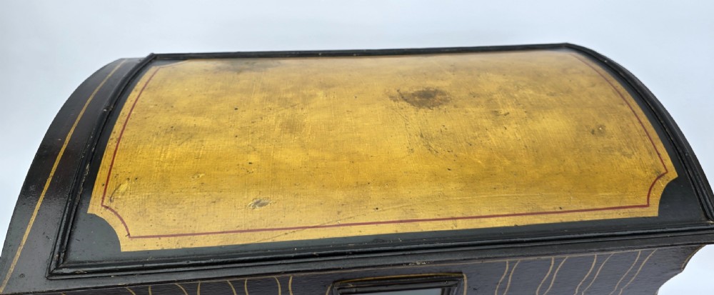 An antique hand-painted wooden model of a Romani gypsy caravan vardo with yellow spoked wheels and floral detail. View XII