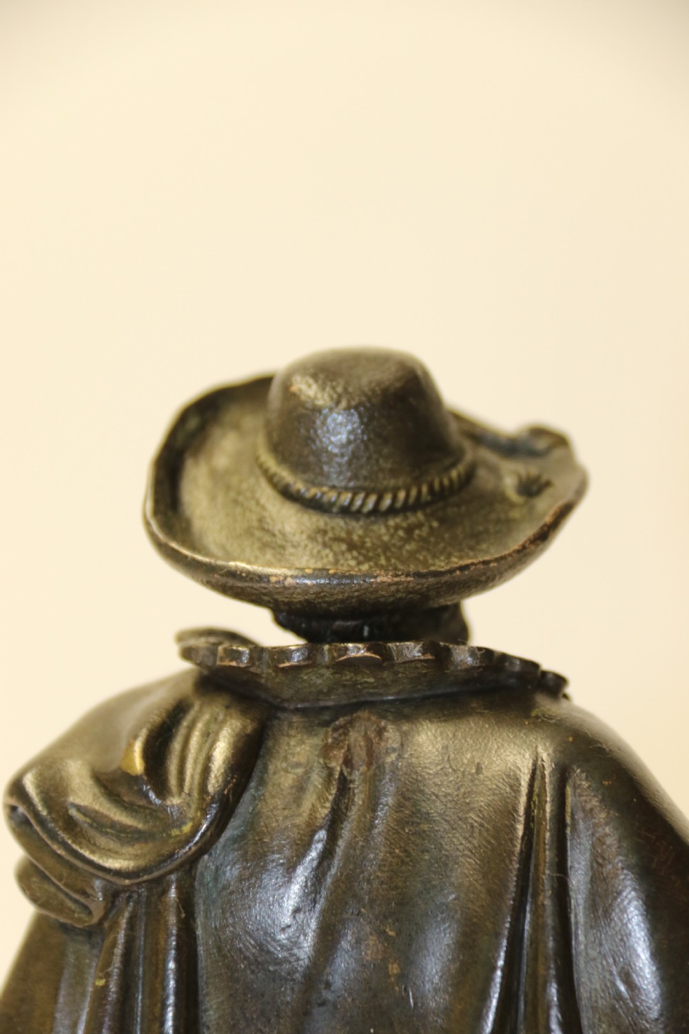 A nineteenth-century patinated bronze sculpture depicting painter Anthony van Dyck in seventeenth-century dress standing on a circular integral base. View XV