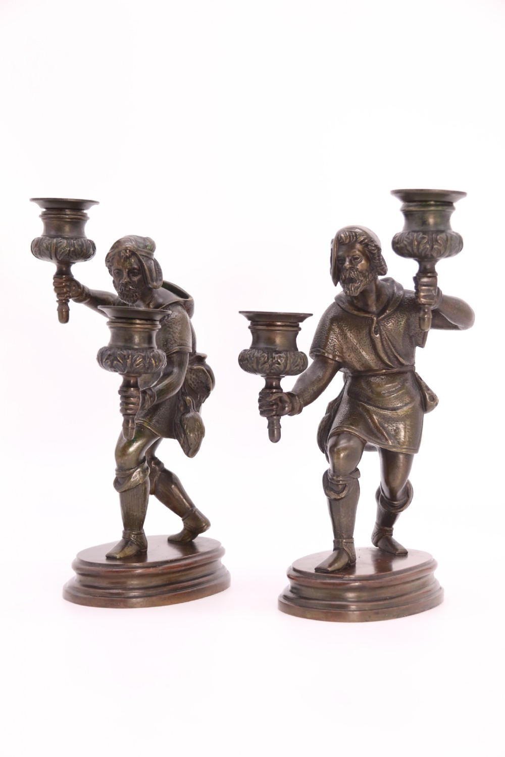 A pair of 19th-century patinated dark bronze double candlesticks featuring sculpted male figures standing on oval bases and holding two sconces each. View VII