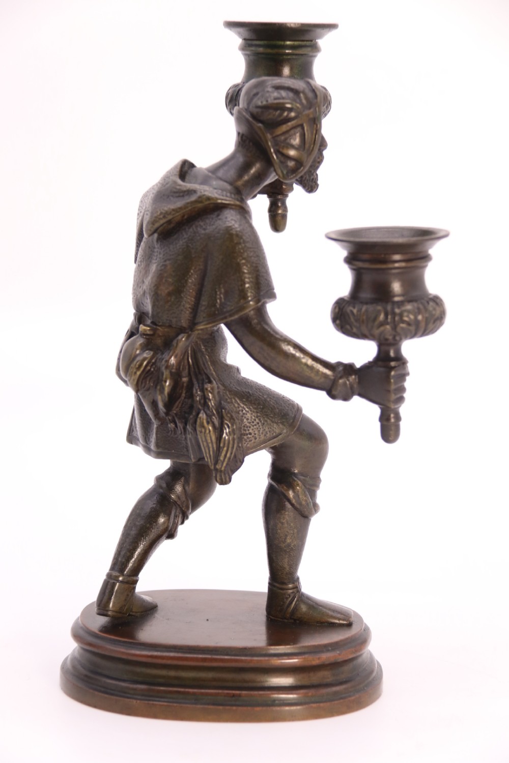 A pair of 19th-century patinated dark bronze double candlesticks featuring sculpted male figures standing on oval bases and holding two sconces each. View XXIII