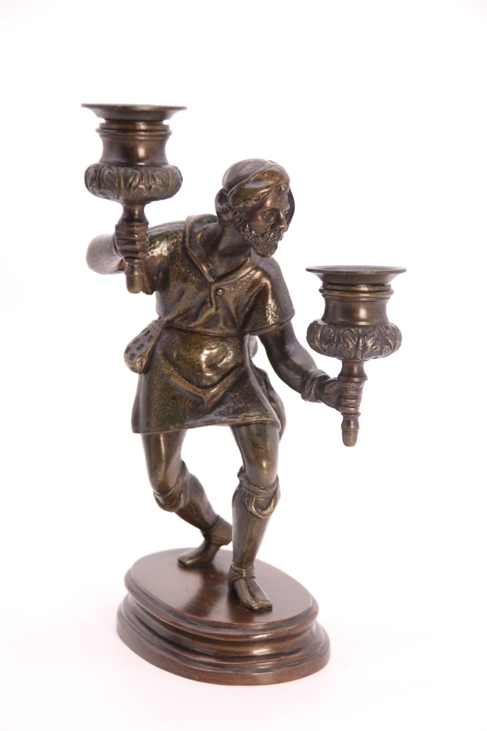 A pair of 19th-century patinated dark bronze double candlesticks featuring sculpted male figures standing on oval bases and holding two sconces each. View XXVI