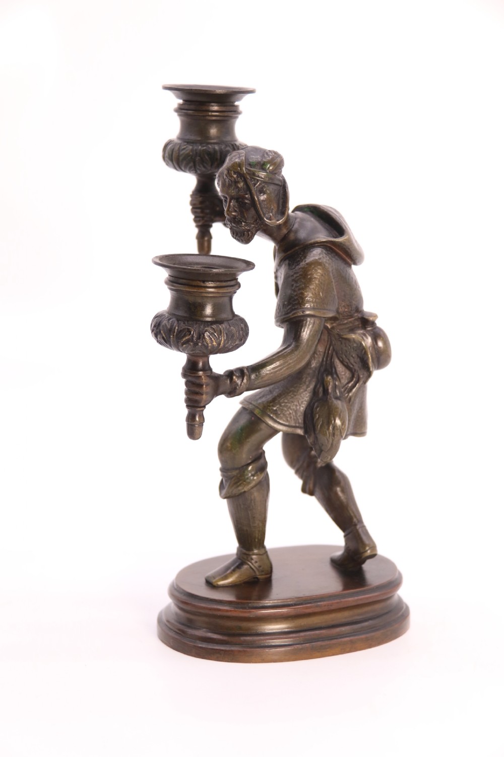 A pair of 19th-century patinated dark bronze double candlesticks featuring sculpted male figures standing on oval bases and holding two sconces each. View XXIX