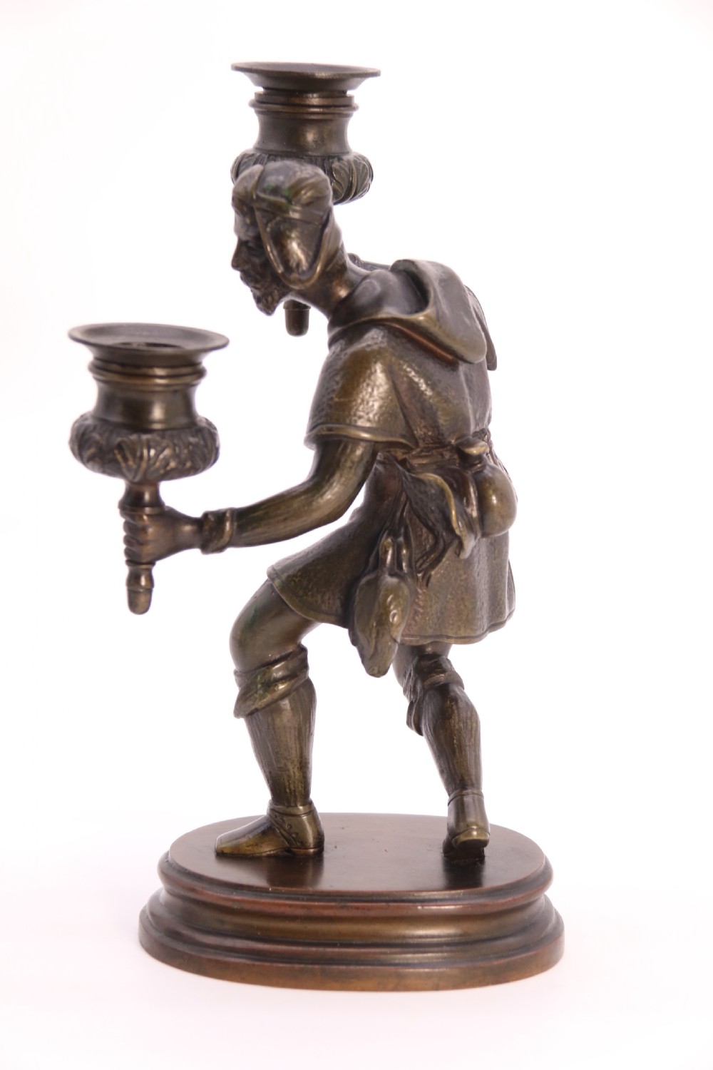 A pair of 19th-century patinated dark bronze double candlesticks featuring sculpted male figures standing on oval bases and holding two sconces each. View XXX