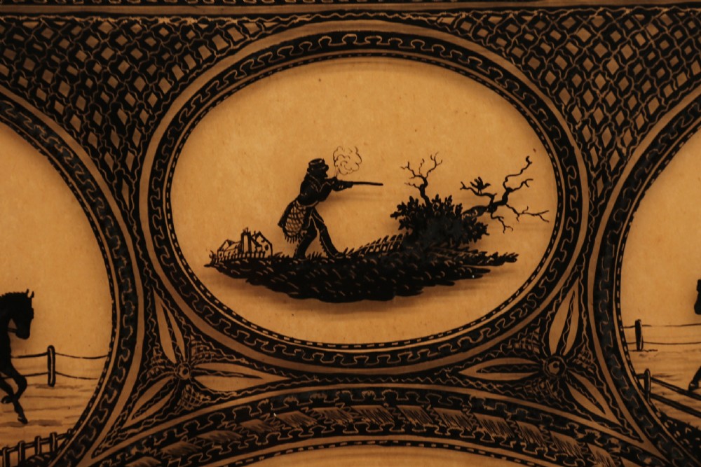 A Victorian framed reverse glass painting featuring multiple oval vignettes of equestrian hunting, coaching, and racing silhouettes set against a sepia background. View III