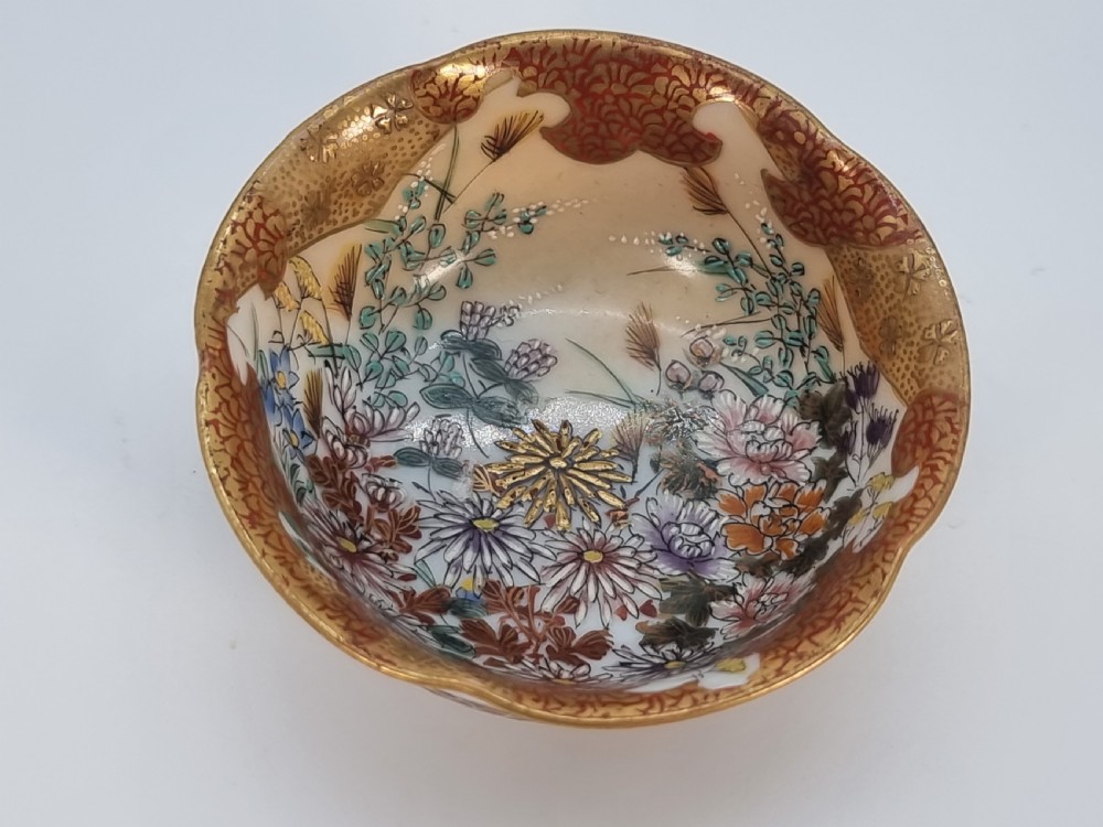 A pair of round Japanese Kutani porcelain miniature bowls with lobed gilded rims and interior hand-painted enamel chrysanthemum motifs. View VI
