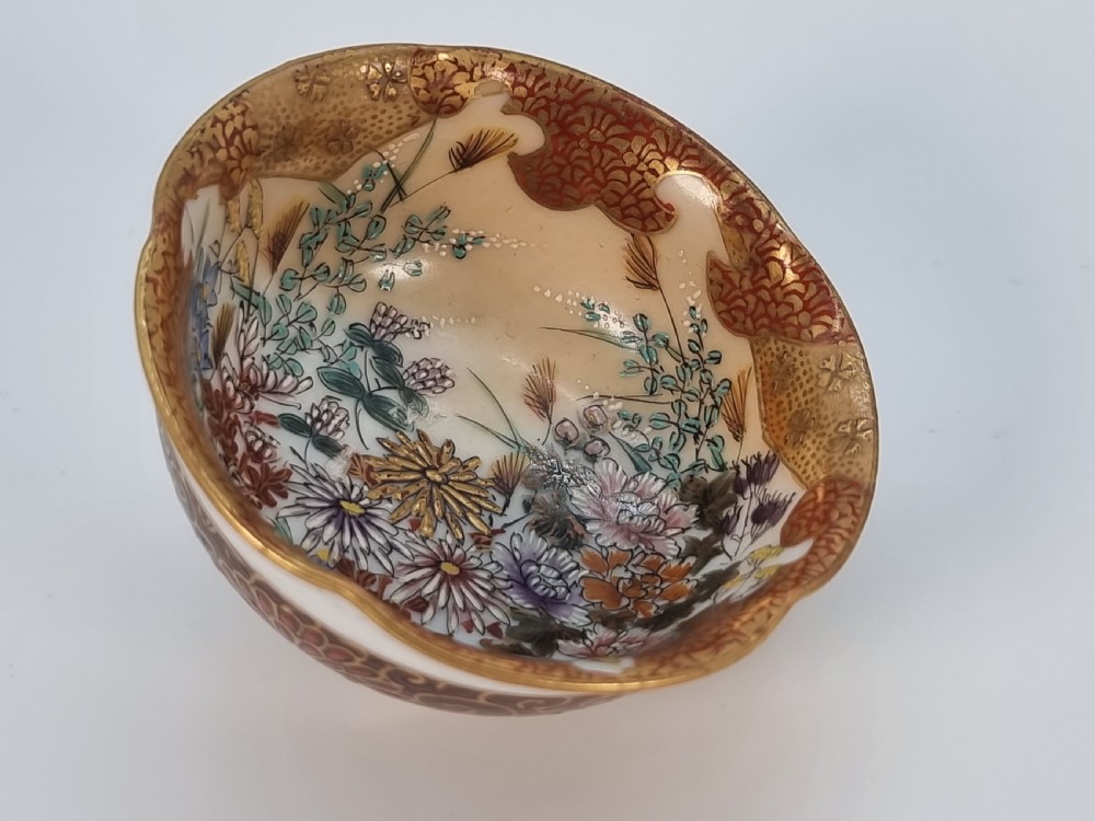 A pair of round Japanese Kutani porcelain miniature bowls with lobed gilded rims and interior hand-painted enamel chrysanthemum motifs. View IX