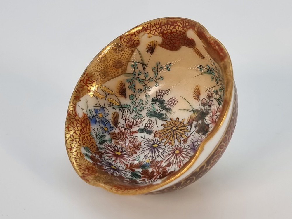 A pair of round Japanese Kutani porcelain miniature bowls with lobed gilded rims and interior hand-painted enamel chrysanthemum motifs. View XI