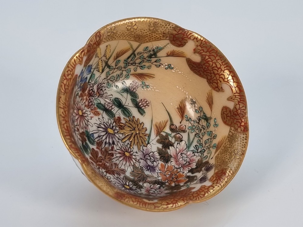 A pair of round Japanese Kutani porcelain miniature bowls with lobed gilded rims and interior hand-painted enamel chrysanthemum motifs. View XII