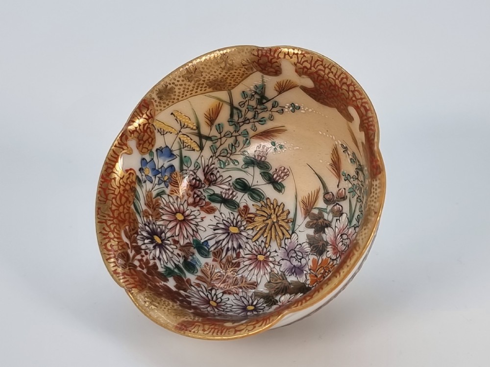 A pair of round Japanese Kutani porcelain miniature bowls with lobed gilded rims and interior hand-painted enamel chrysanthemum motifs. View XIII
