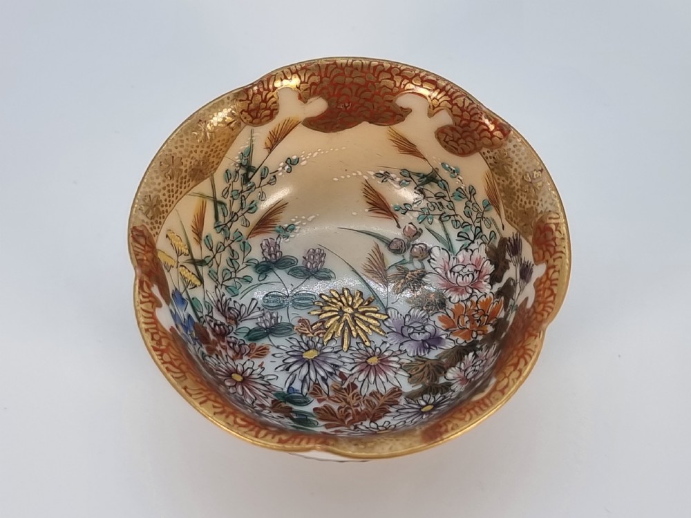 A pair of round Japanese Kutani porcelain miniature bowls with lobed gilded rims and interior hand-painted enamel chrysanthemum motifs. View XIV