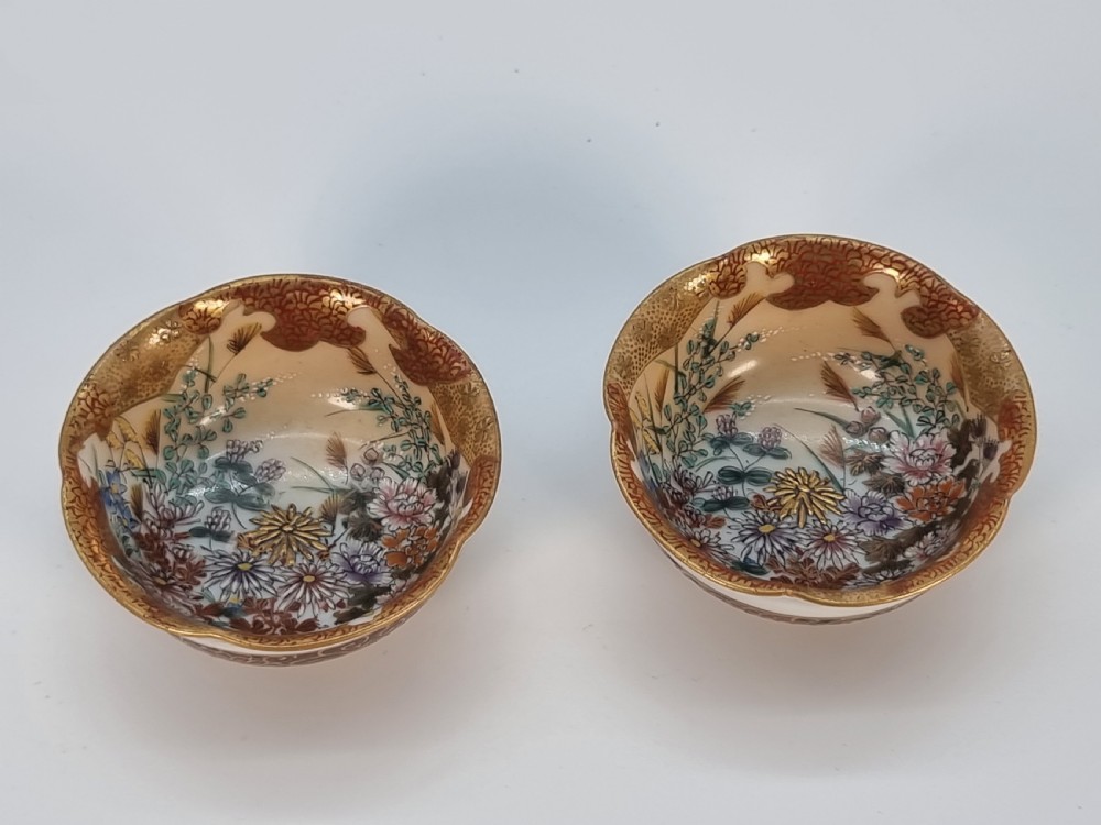 A pair of round Japanese Kutani porcelain miniature bowls with lobed gilded rims and interior hand-painted enamel chrysanthemum motifs. View XVI