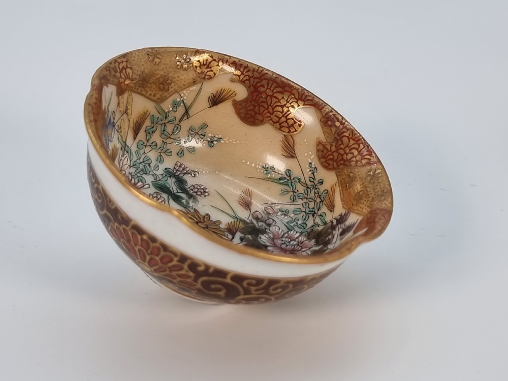 A pair of round Japanese Kutani porcelain miniature bowls with lobed gilded rims and interior hand-painted enamel chrysanthemum motifs. View XVII