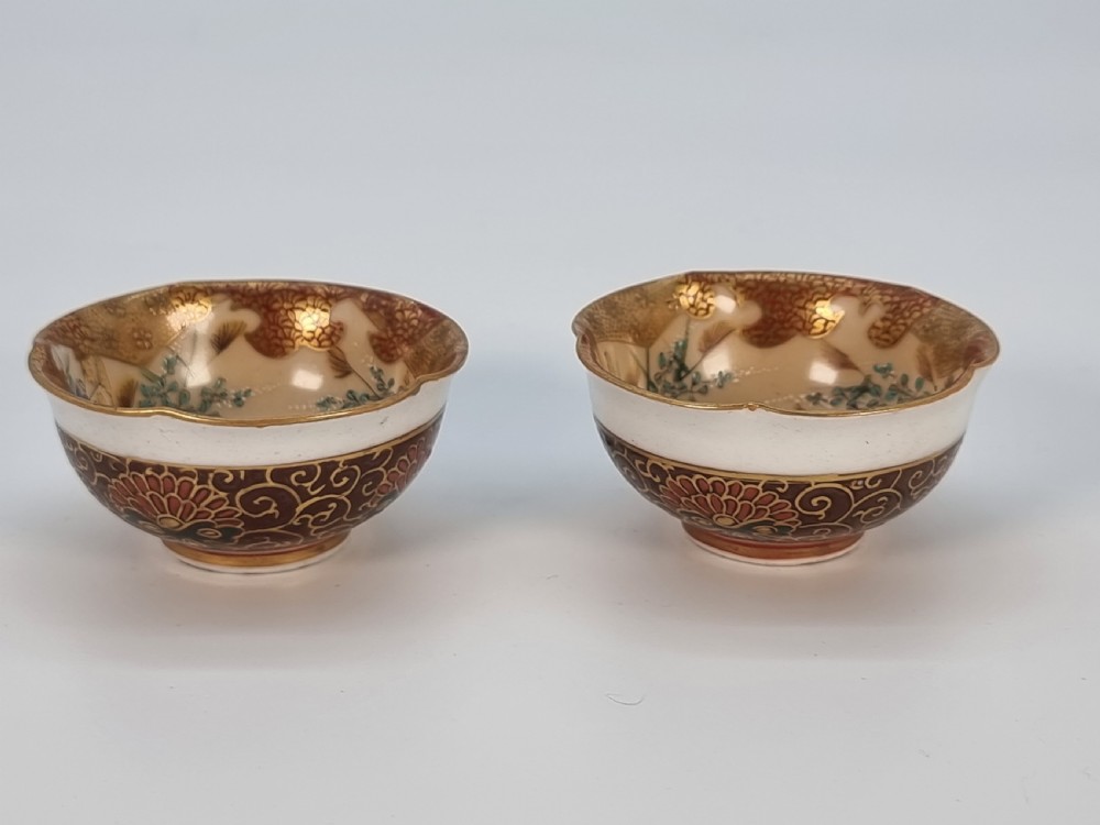A pair of round Japanese Kutani porcelain miniature bowls with lobed gilded rims and interior hand-painted enamel chrysanthemum motifs. View XX