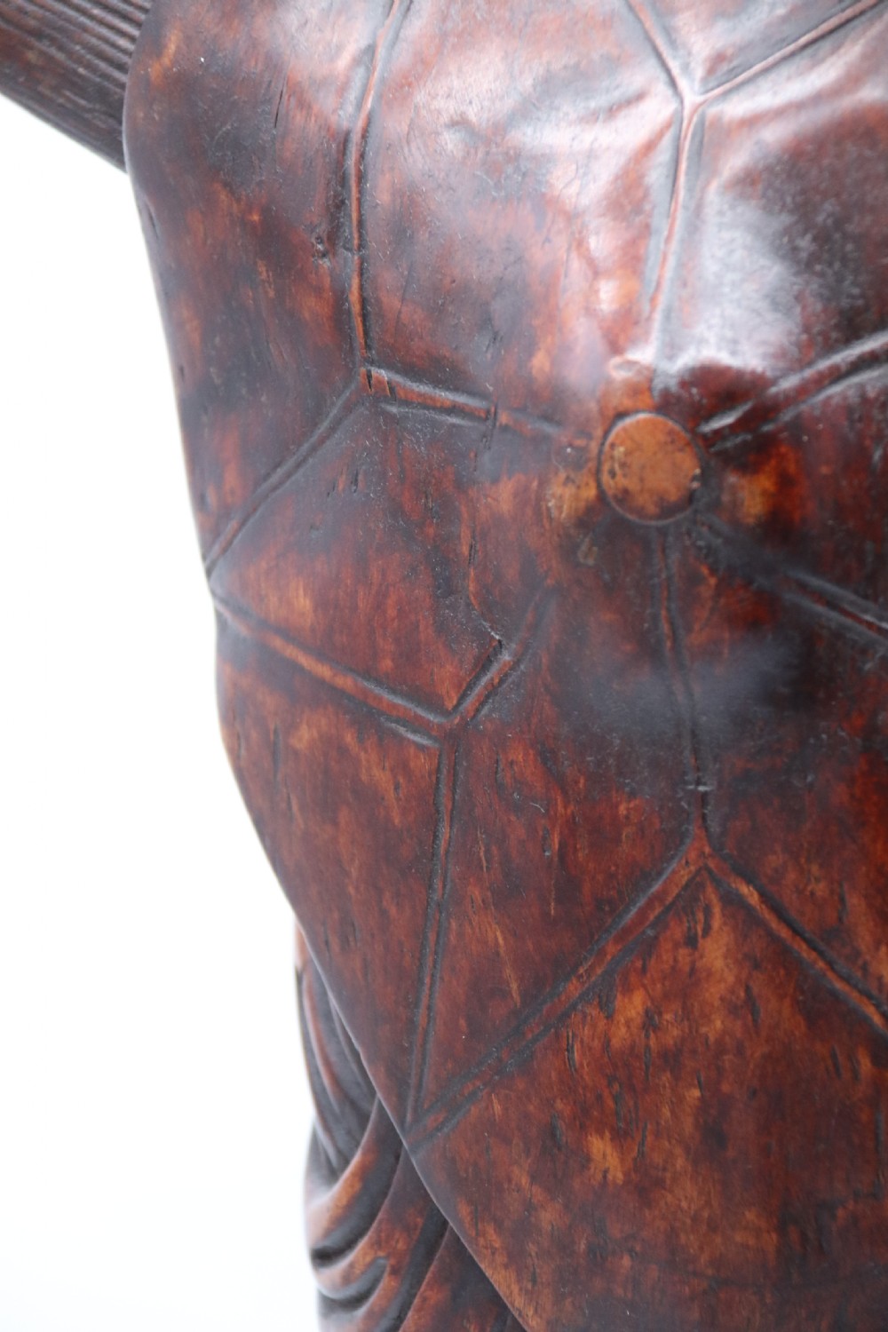 A late 19th-century Japanese Meiji period carved hardwood okimono depicting a standing male figure with a staff, scroll, and fruit on a textured base. View XX