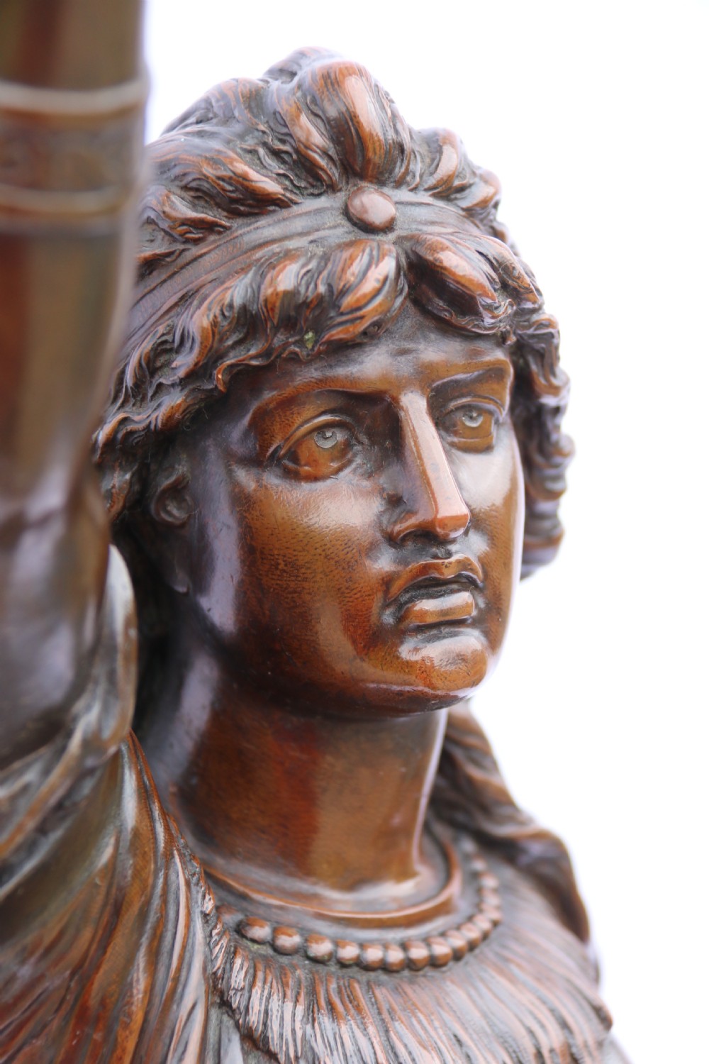 A 19th-century dark patinated bronze sculpture depicting Queen Boadicea in draped robes raising a dagger in her right hand while standing on a rocky base. View XIII