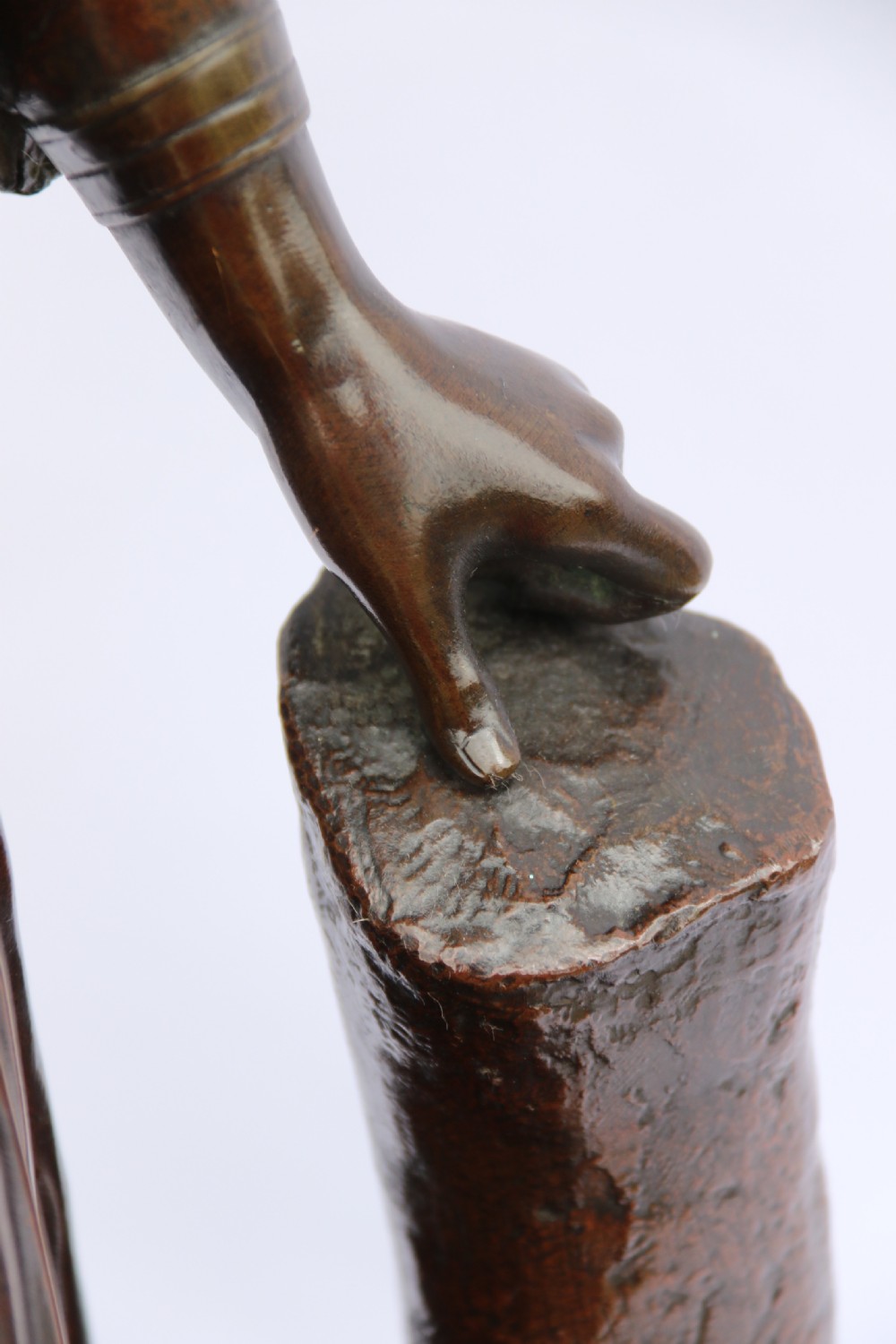 A 19th-century dark patinated bronze sculpture depicting Queen Boadicea in draped robes raising a dagger in her right hand while standing on a rocky base. View XV