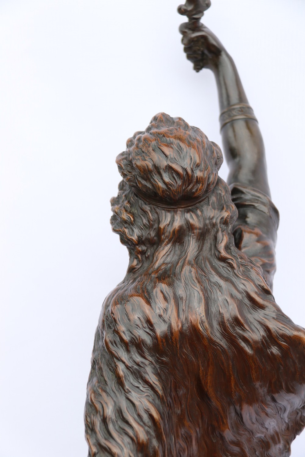 A 19th-century dark patinated bronze sculpture depicting Queen Boadicea in draped robes raising a dagger in her right hand while standing on a rocky base. View XXII