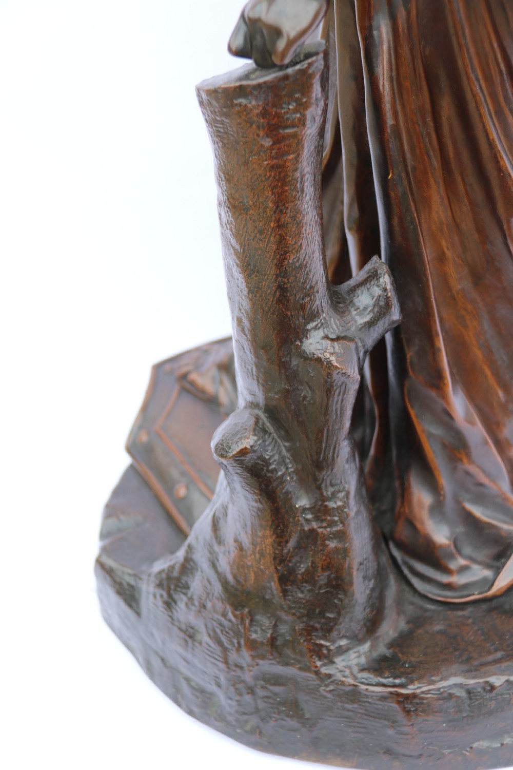 A 19th-century dark patinated bronze sculpture depicting Queen Boadicea in draped robes raising a dagger in her right hand while standing on a rocky base. View XXIII