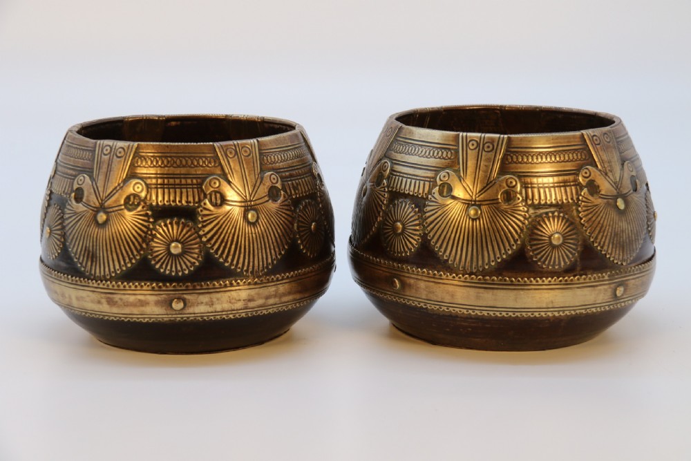 A pair of mid-19th-century Indian brass ceremonial bowls featuring intricate hand-engraved bird and sunburst motifs. View II