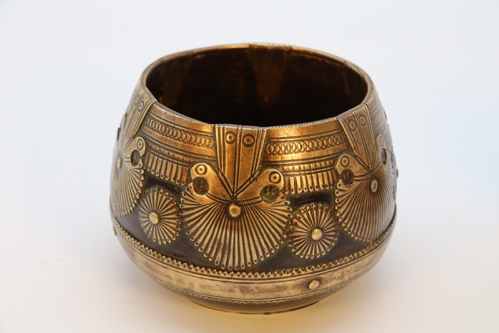 A pair of mid-19th-century Indian brass ceremonial bowls featuring intricate hand-engraved bird and sunburst motifs. View III