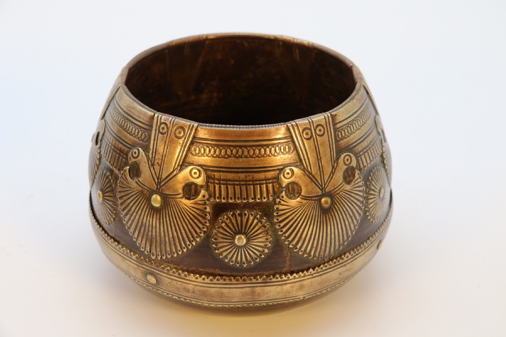 A pair of mid-19th-century Indian brass ceremonial bowls featuring intricate hand-engraved bird and sunburst motifs. View IV