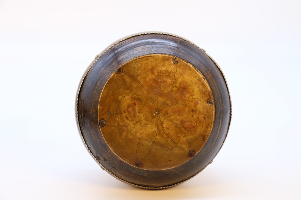A pair of mid-19th-century Indian brass ceremonial bowls featuring intricate hand-engraved bird and sunburst motifs. View VI