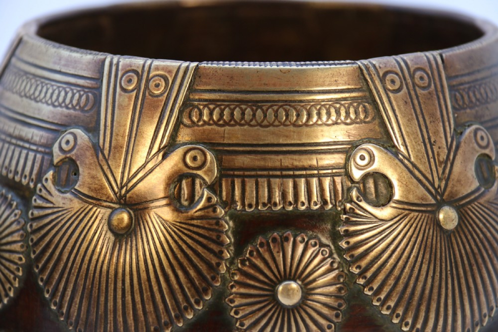 A pair of mid-19th-century Indian brass ceremonial bowls featuring intricate hand-engraved bird and sunburst motifs. View XV