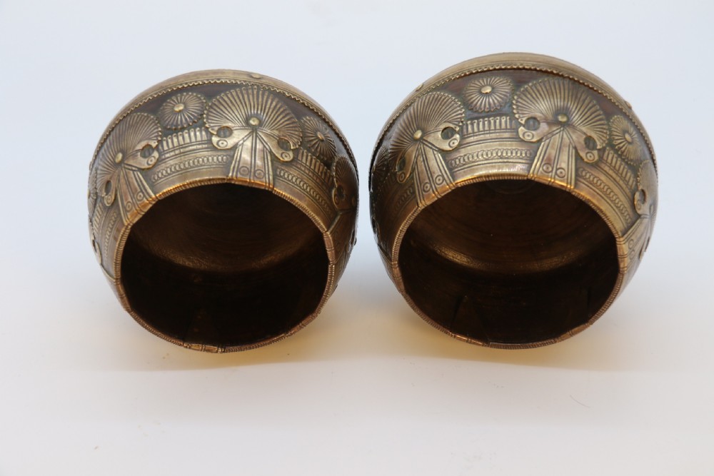A pair of mid-19th-century Indian brass ceremonial bowls featuring intricate hand-engraved bird and sunburst motifs. View XVII