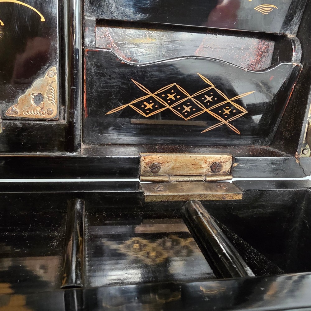 A black lacquer Japanese writing box decorated with detailed gold botanical and bird illustrations, featuring a hinged lid opening to internal correspondence slots. View XI