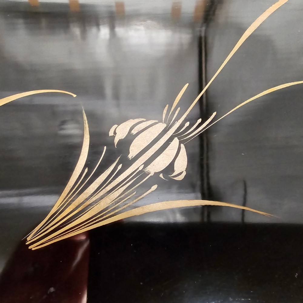 A black lacquer Japanese writing box decorated with detailed gold botanical and bird illustrations, featuring a hinged lid opening to internal correspondence slots. View XIII