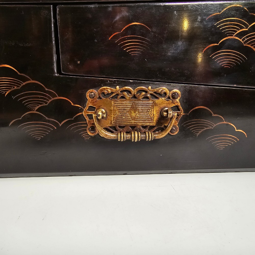 A black lacquer Japanese writing box decorated with detailed gold botanical and bird illustrations, featuring a hinged lid opening to internal correspondence slots. View XXIII