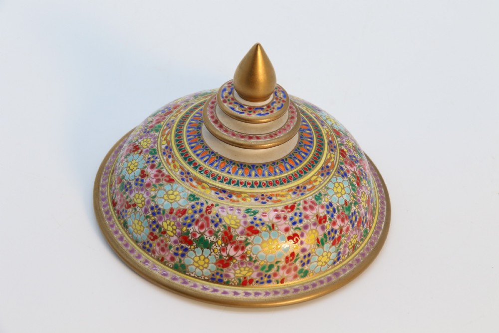 A polychrome enamelled ceramic jar with a fitted stepped lid featuring intricate floral motifs and a gilded conical finial. View VI