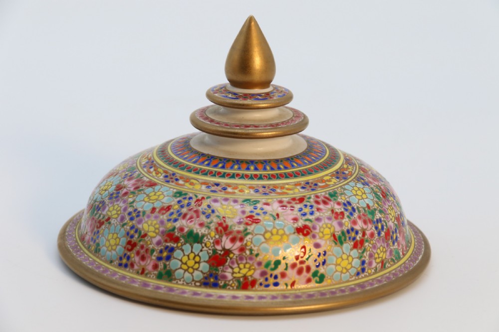 A polychrome enamelled ceramic jar with a fitted stepped lid featuring intricate floral motifs and a gilded conical finial. View VII