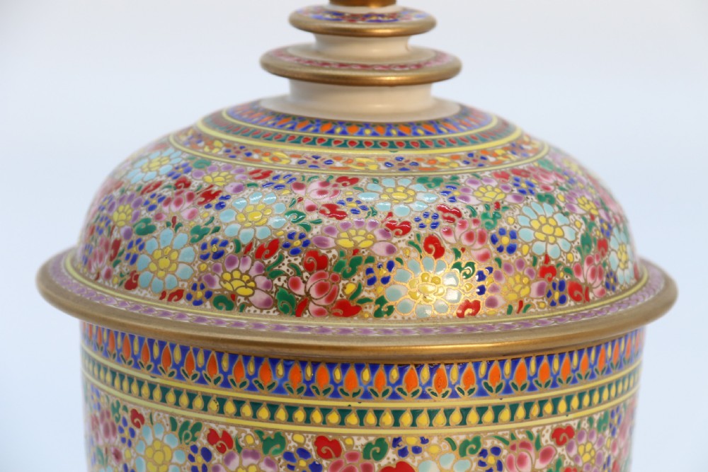 A polychrome enamelled ceramic jar with a fitted stepped lid featuring intricate floral motifs and a gilded conical finial. View XIV