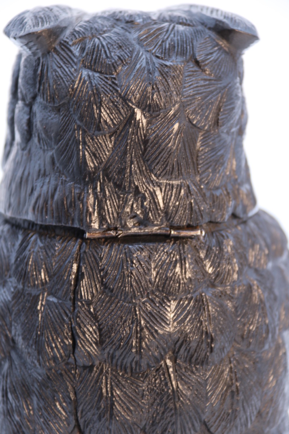 A hand-carved dark oak inkstand crafted in the likeness of an owl with glass eyes and a brass tether, resting on a carved base with shamrock details. View XXVI