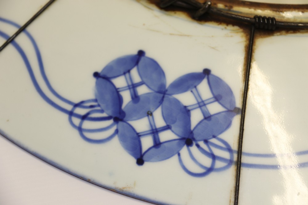 A circular hand-painted Japanese Imari porcelain charger featuring cobalt blue, iron red, and gilt decorative panels depicting birds, goldfish, and botanical motifs. View XII