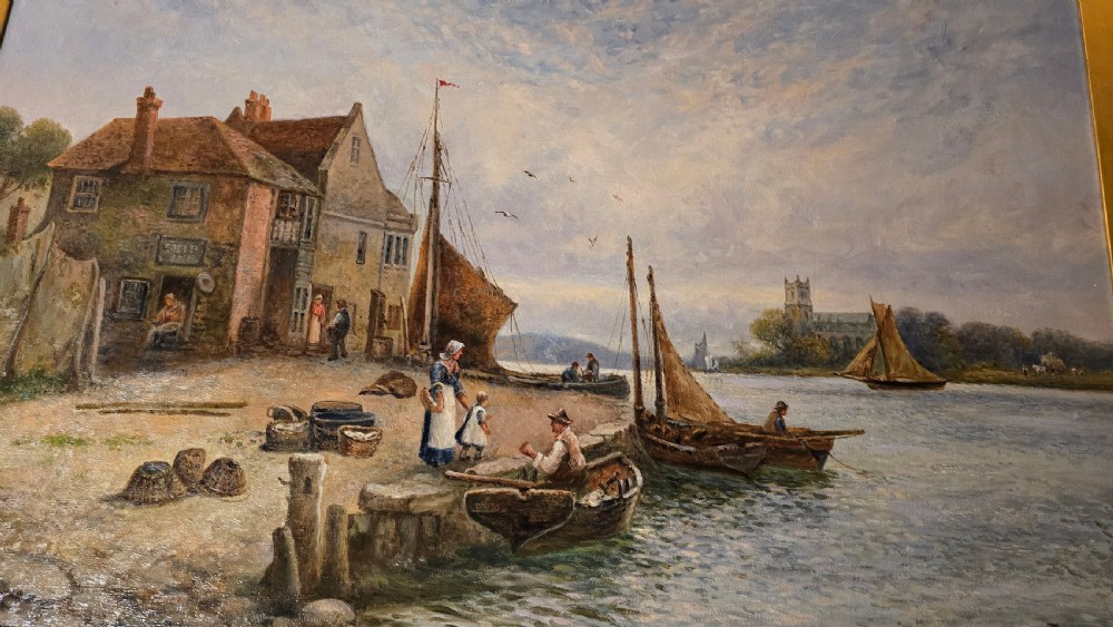 An oil painting depicting a harbour scene with sailboats and buildings, encased in a carved gold gilt frame. View VII