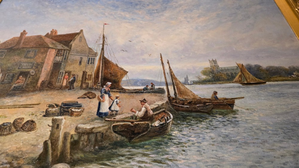 An oil painting depicting a harbour scene with sailboats and buildings, encased in a carved gold gilt frame. View IX