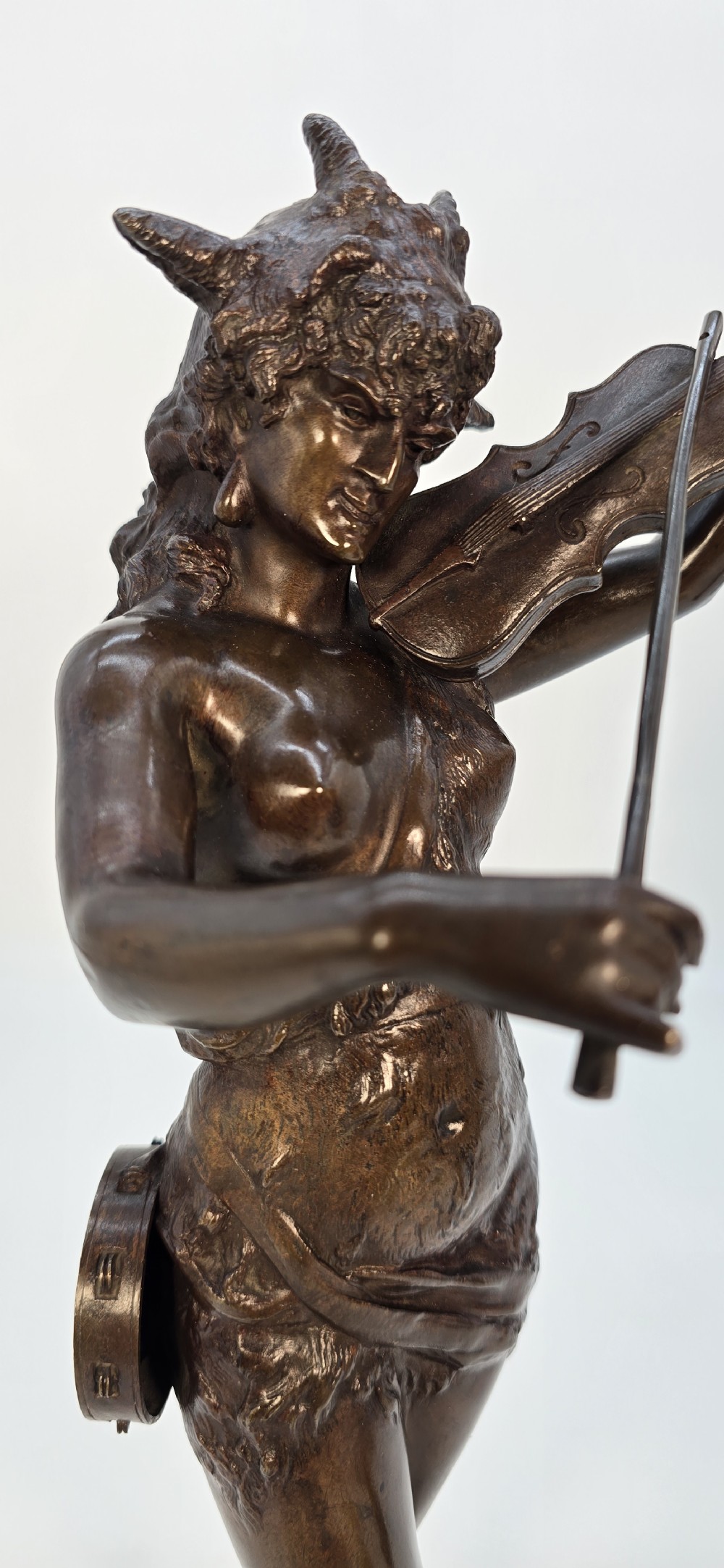 A pair of late 19th-century bronze statuettes depicting theatrical figures playing stringed musical instruments on square bases. View XVIII