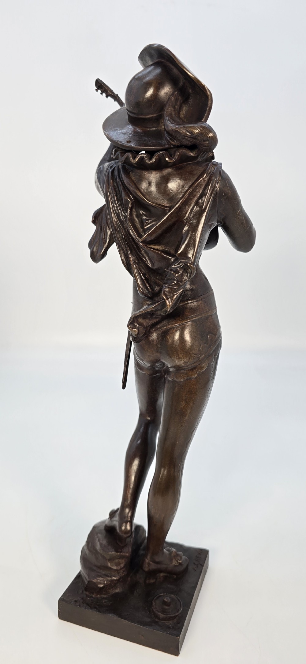 A pair of late 19th-century bronze statuettes depicting theatrical figures playing stringed musical instruments on square bases. View XXIV