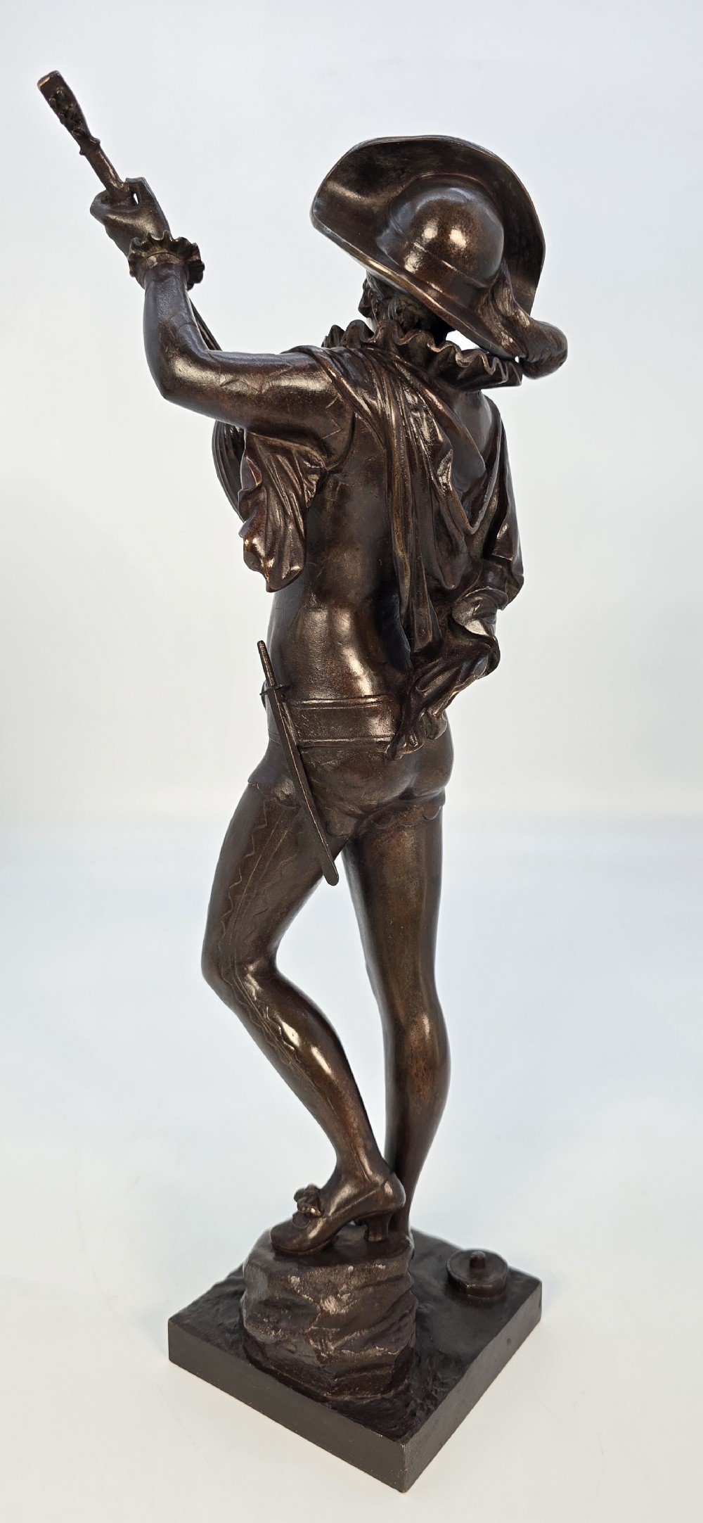 A pair of late 19th-century bronze statuettes depicting theatrical figures playing stringed musical instruments on square bases. View XXV