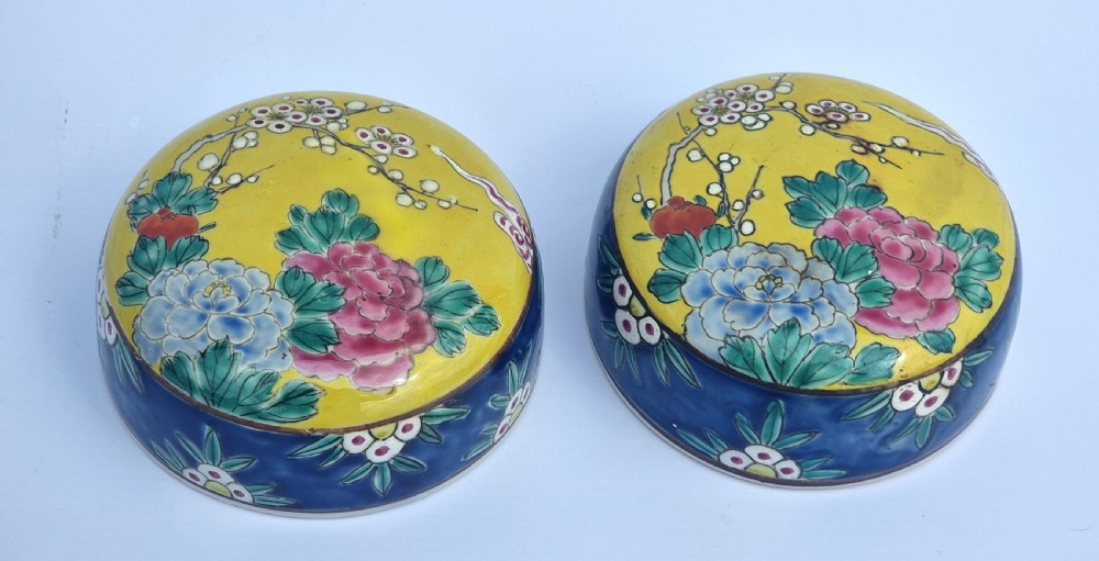 A matching pair of yellow porcelain ginger jars featuring hand-painted blue and turquoise phoenixes among peonies and floral branches, topped with deep blue decorated lids. View XII
