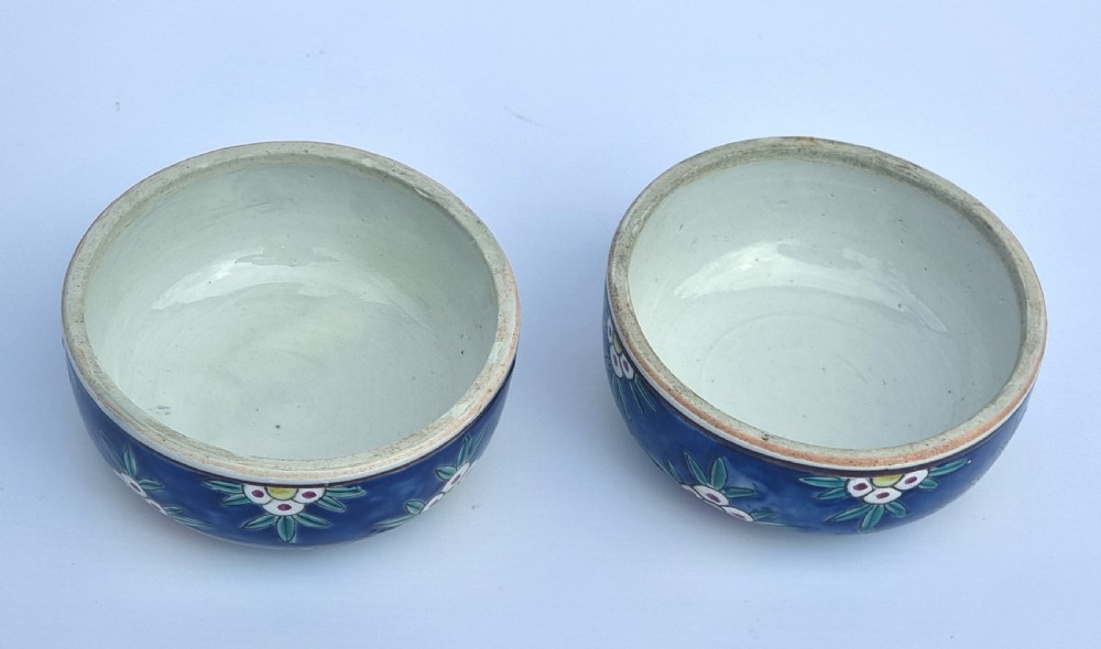 A matching pair of yellow porcelain ginger jars featuring hand-painted blue and turquoise phoenixes among peonies and floral branches, topped with deep blue decorated lids. View XIV